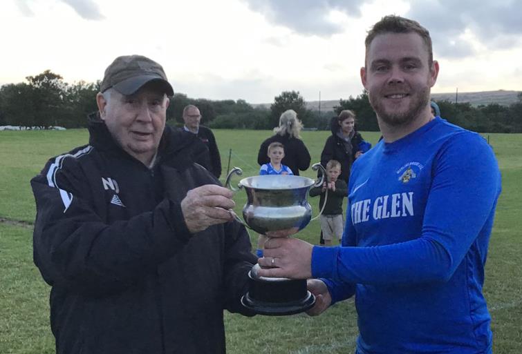 Joe Leahy receives cup from Nigel Davies